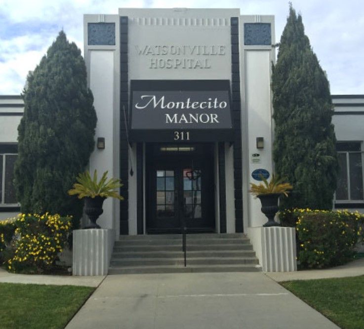Montecito Manor senior living community featuring lush greenery, modern architecture, and a library.