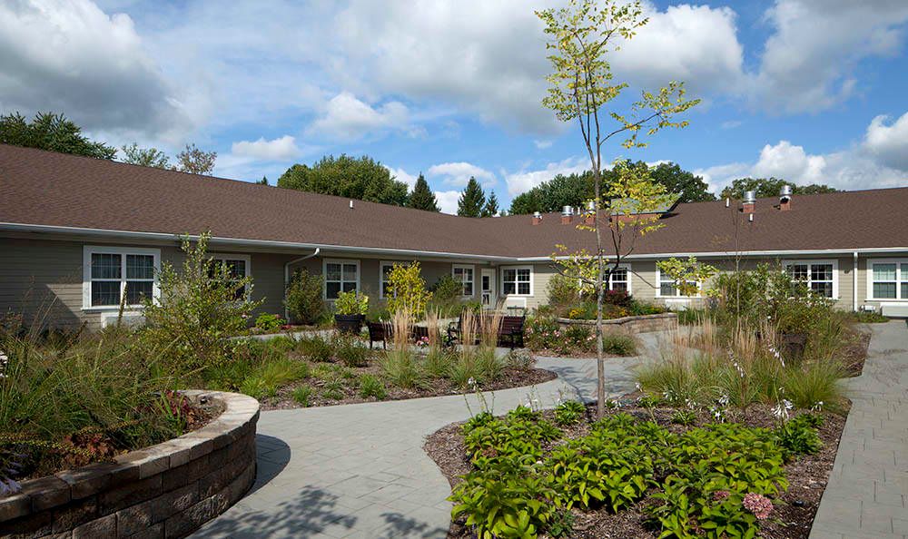 Senior living community, The Springs of Vernon Hills, featuring lush greenery and suburban architecture.