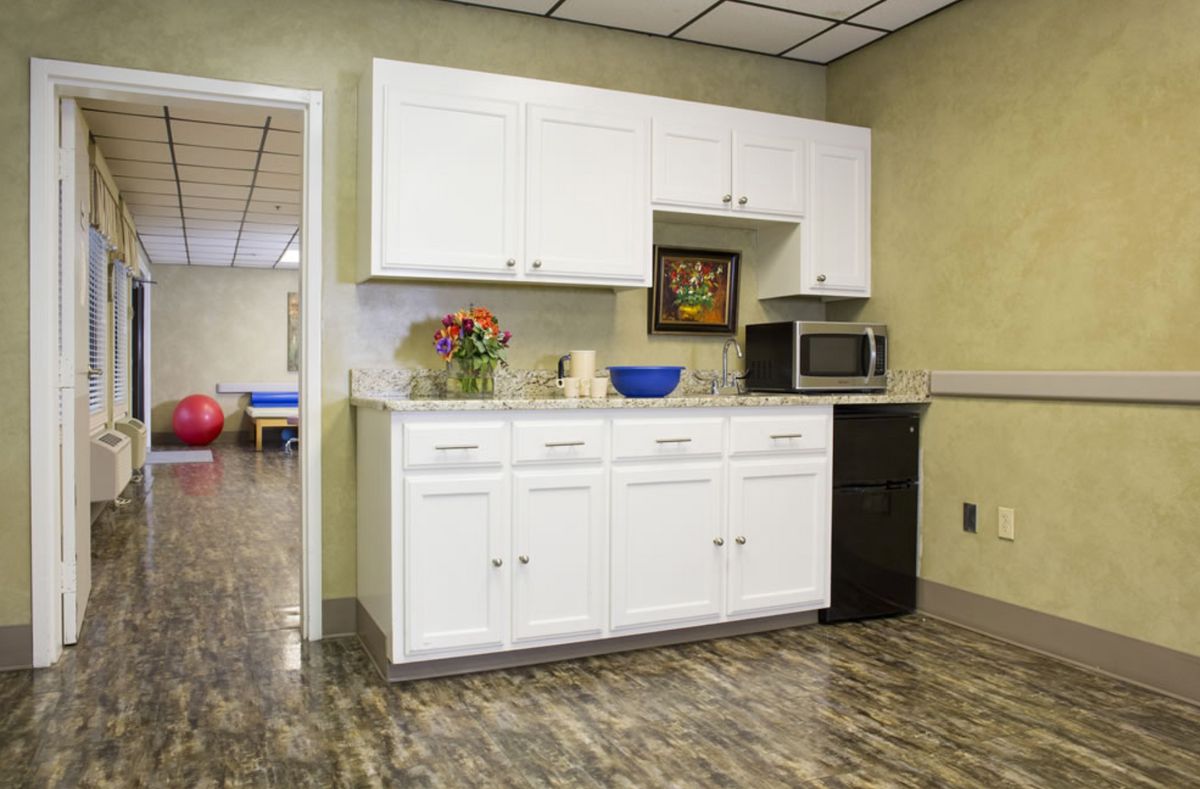 Interior view of Stella Manor Nursing and Rehabilitation Center featuring modern kitchen and decor.