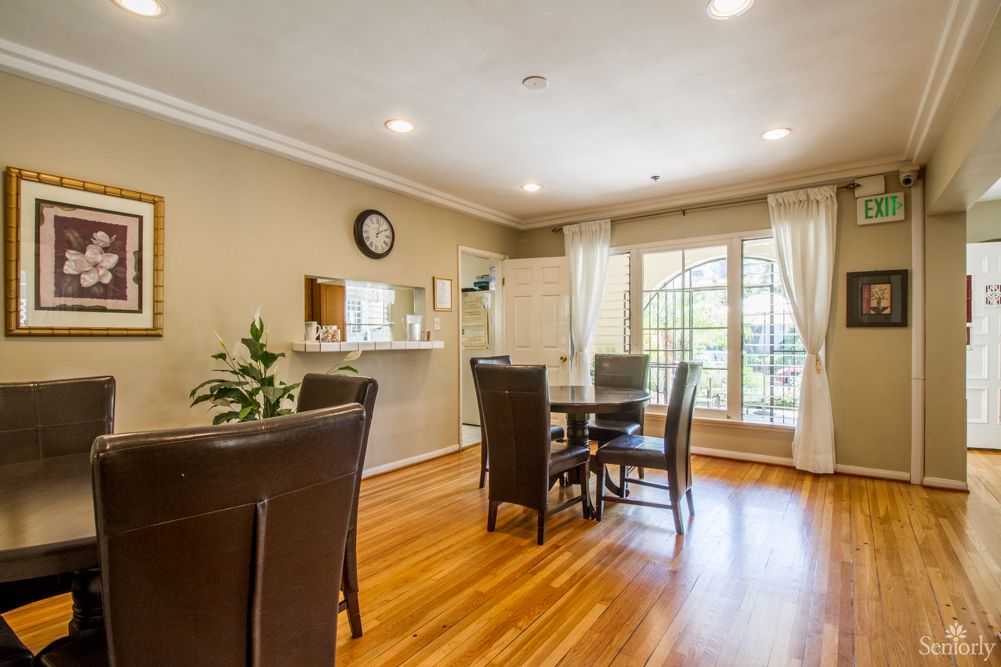 Senior living community Astoria 2 featuring hardwood flooring, dining room furniture, and home decor.