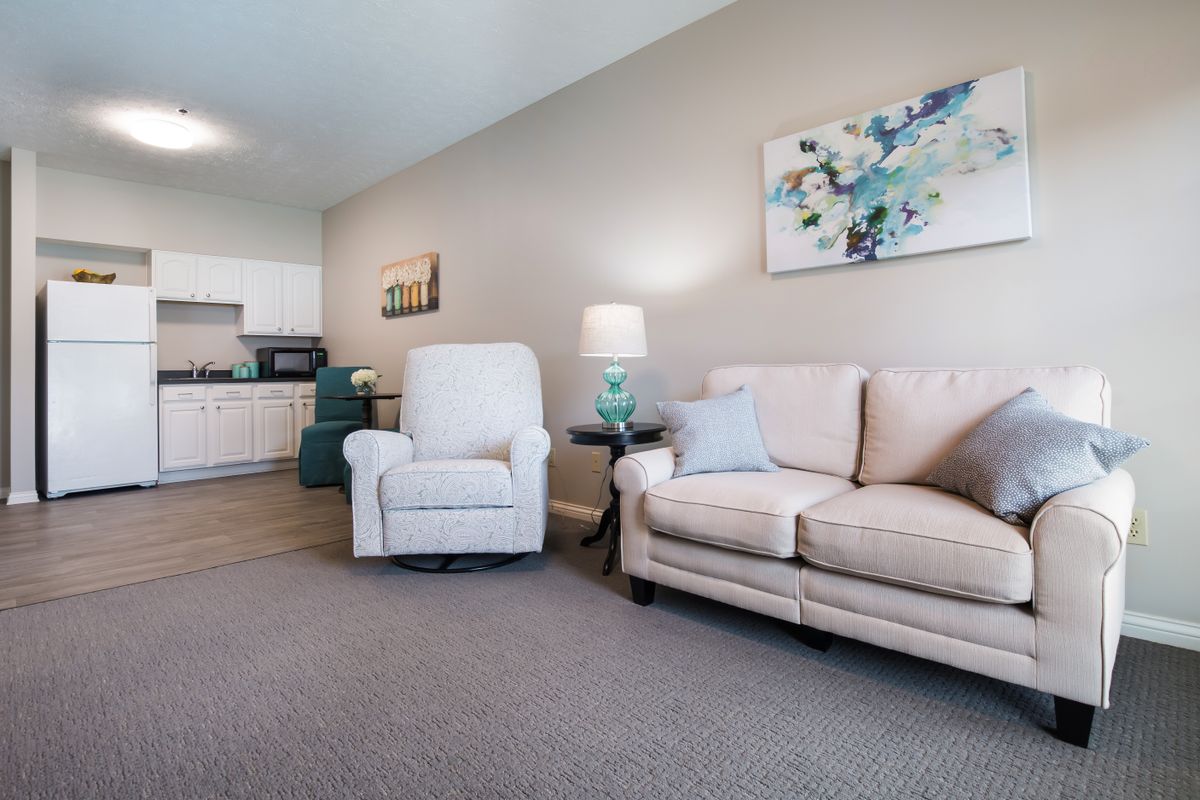 Senior living community interior featuring modern architecture, furniture, and appliances.
