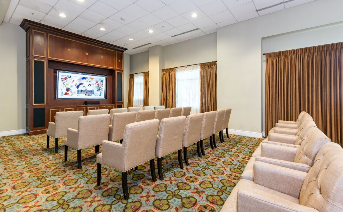 Interior view of Sterling Aventura senior living community with modern furniture and electronics.