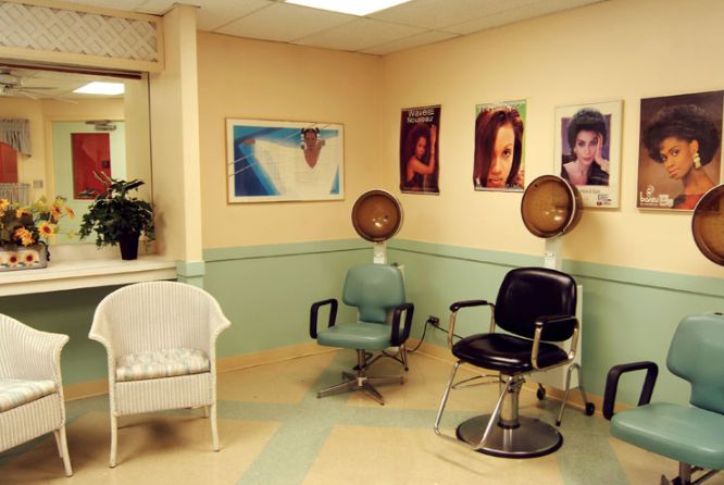 Senior resident enjoying art in the beauty salon at Princeton Rehab & Health Care Center.