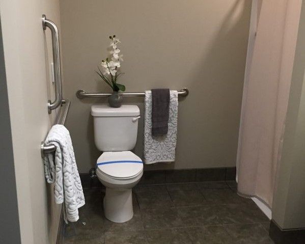 Interior view of a room with bathroom facilities at Princeton Transitional Care & Assisted Living.