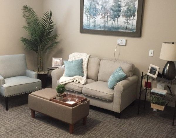 Senior living room at Princeton Transitional Care & Assisted Living with cozy furniture and decor.