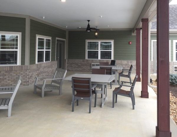 Princeton Transitional Care & Assisted Living facility featuring furnished rooms and outdoor patio.