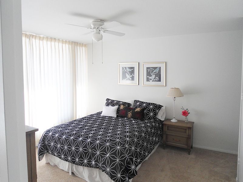 Interior view of a furnished bedroom with appliances in Bixby Knolls senior living community.