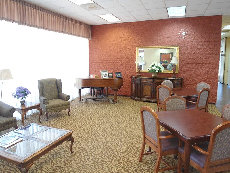 Interior view of Bixby Knolls Tower senior living community featuring dining and reception rooms.