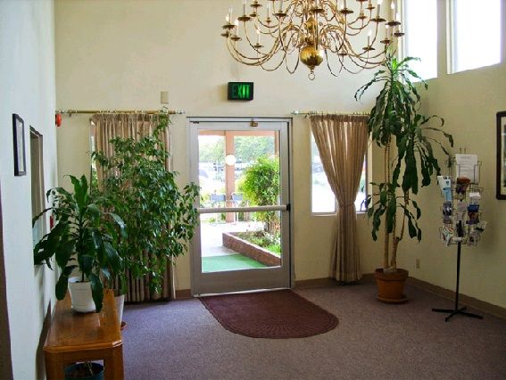 Chic interior of Rialto Assisted Living community featuring home decor, art, and furniture.