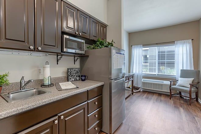 Interior of Brookdale Chandler Regional senior living community featuring a well-equipped kitchen.