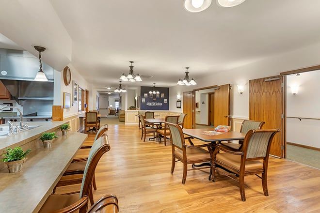 Interior view of Brookdale Midland senior living community featuring dining area and kitchen.