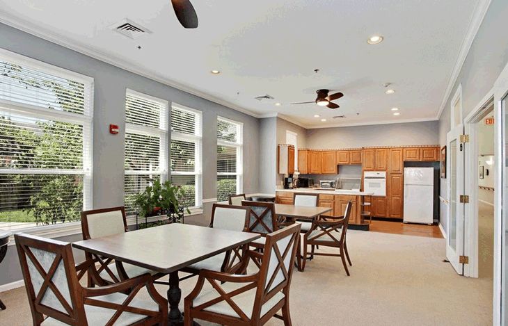 Interior view of American House Lebanon senior living community featuring dining room and kitchen.