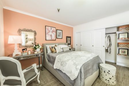Interior view of a cozy bedroom at Magnolia Grand Independent Living with stylish decor.