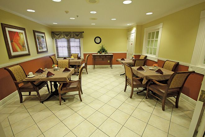 Interior view of Brookdale Meridian senior living community featuring dining area and living room.