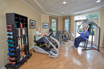 Boy engaging in fitness activities at Goddard House senior living community gym.