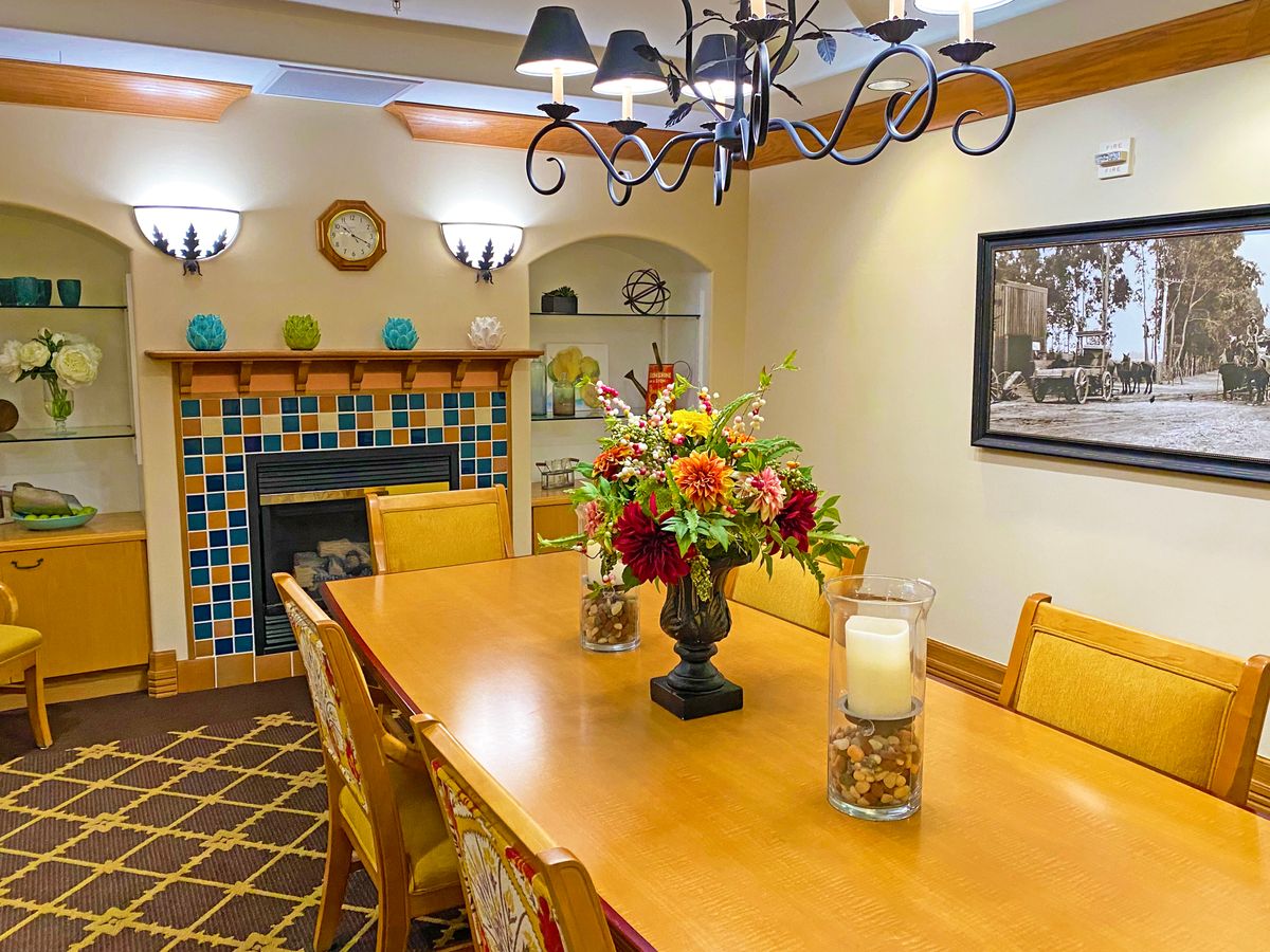 Interior view of AlmaVia of Camarillo senior living community featuring dining room with elegant decor.