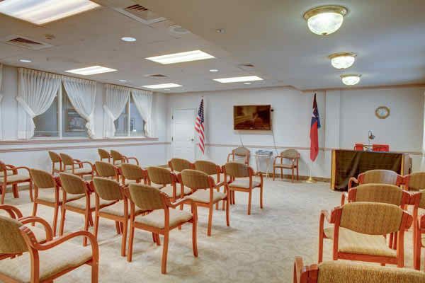 Interior view of Court At Round Rock senior living community featuring a furnished reception room.