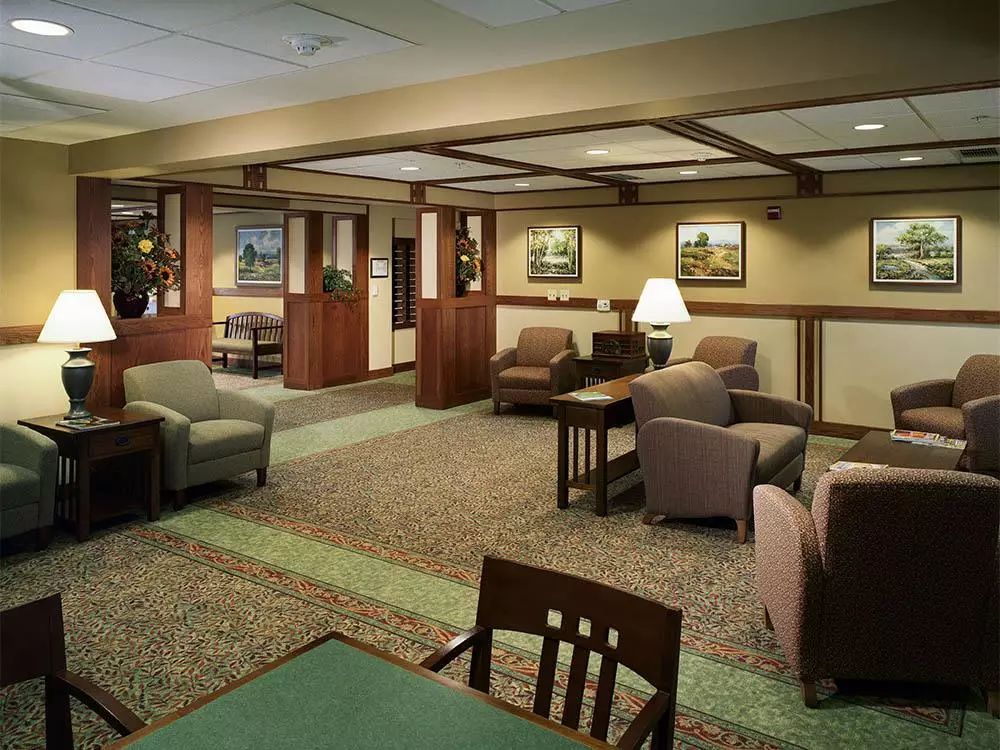 Senior living community lounge at Victory Centre of Bartlett featuring modern architecture and decor.