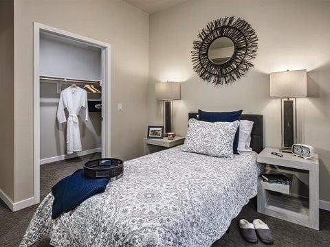 Interior view of a furnished bedroom in Westmont of Cypress senior living community.