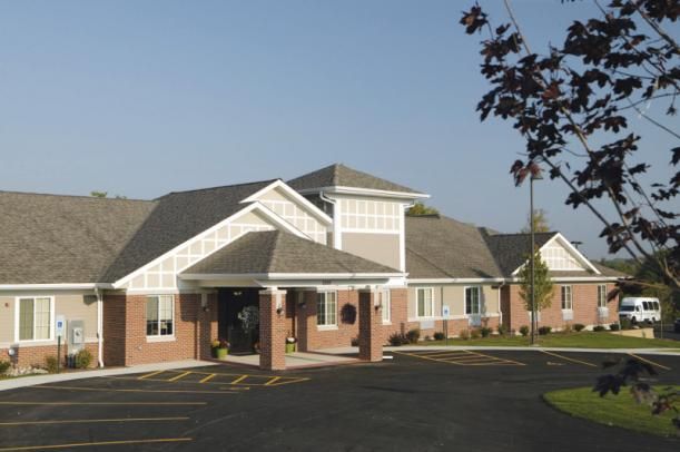 Senior living community, The Courtyard at McHenry, nestled in a peaceful neighborhood, city suburb.