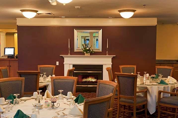 Interior view of RiverWoods Manchester senior living community featuring dining area and modern decor.