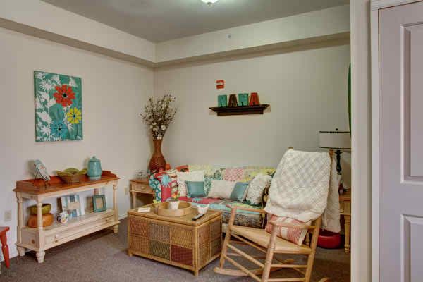 Interior view of The Pointe At Cedar Park senior living community featuring cozy decor.