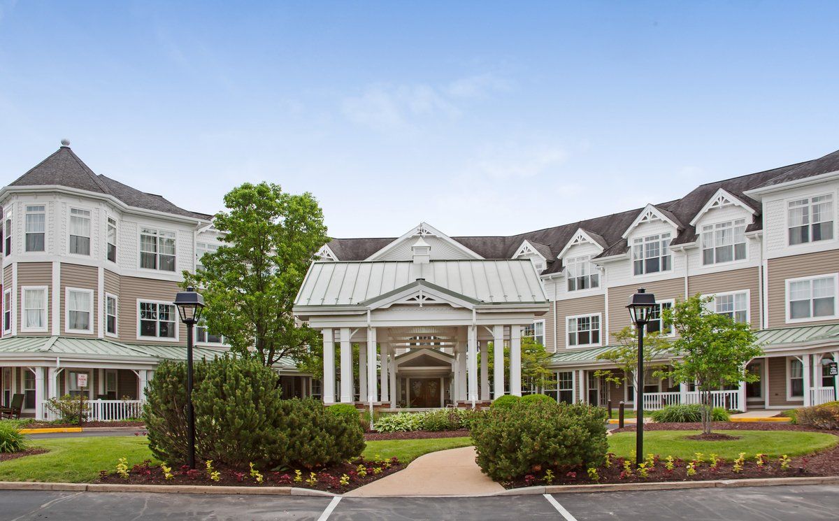 Sunrise of Chesterfield senior living community featuring urban architecture and suburban housing.