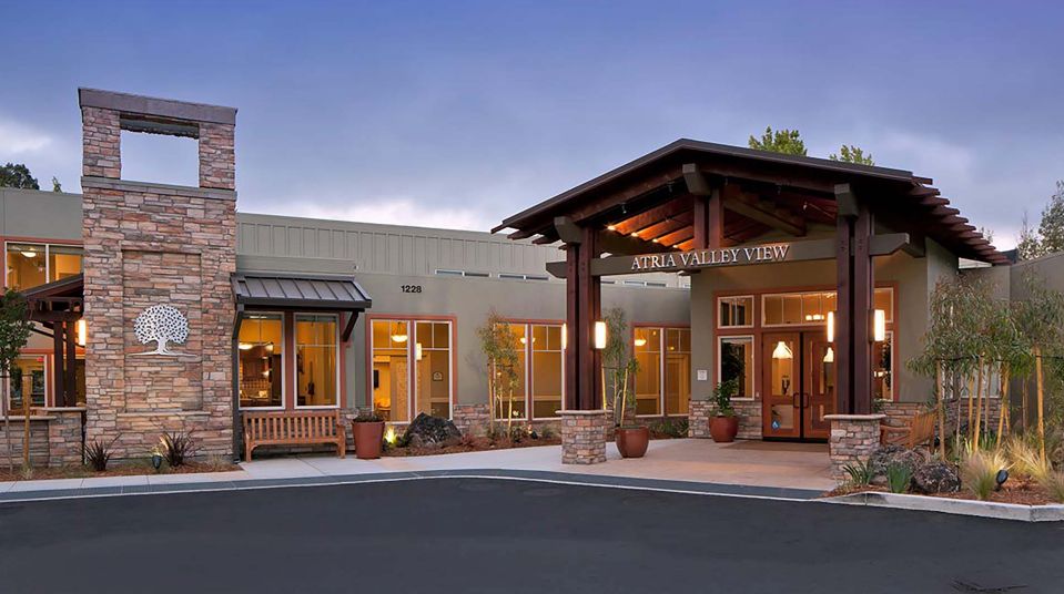 Architectural view of Atria Valley View senior living community with villa-style housing.