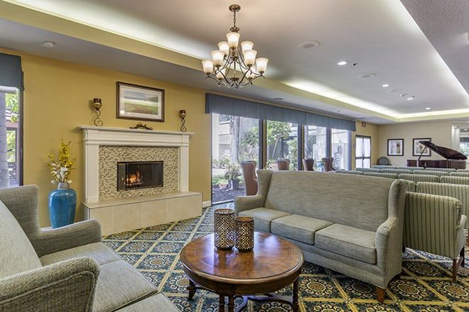 Interior view of Brookdale Irvine senior living community featuring elegant decor and a piano.