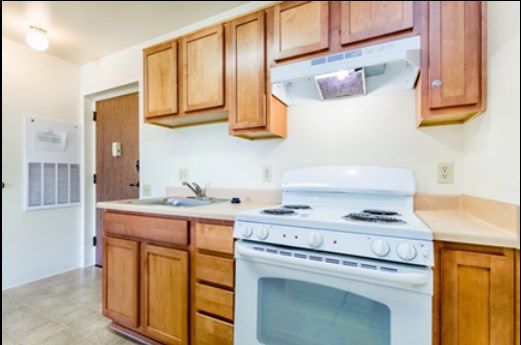 Interior view of Christian Care Manor IV senior living community featuring a well-designed kitchen with modern appliances.