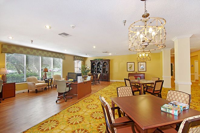 Interior view of Brookdale Chambrel Pinecastle senior living community featuring elegant dining and living spaces.
