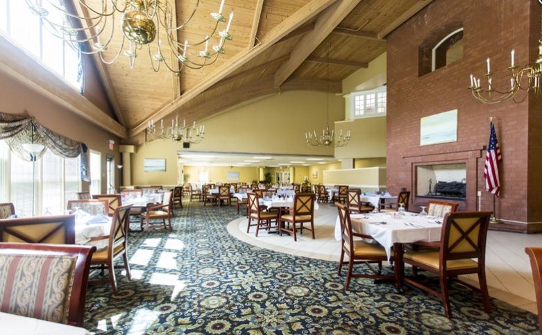 Senior living community interior at Fountains at Cedar Parke featuring dining area and reception room.