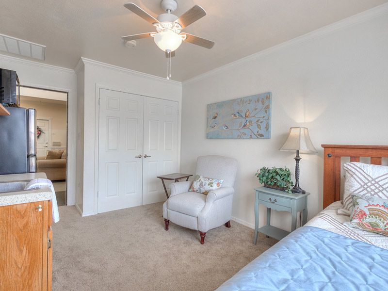 Bedroom interior at Azalea Estates of Shreveport senior living community with modern decor.