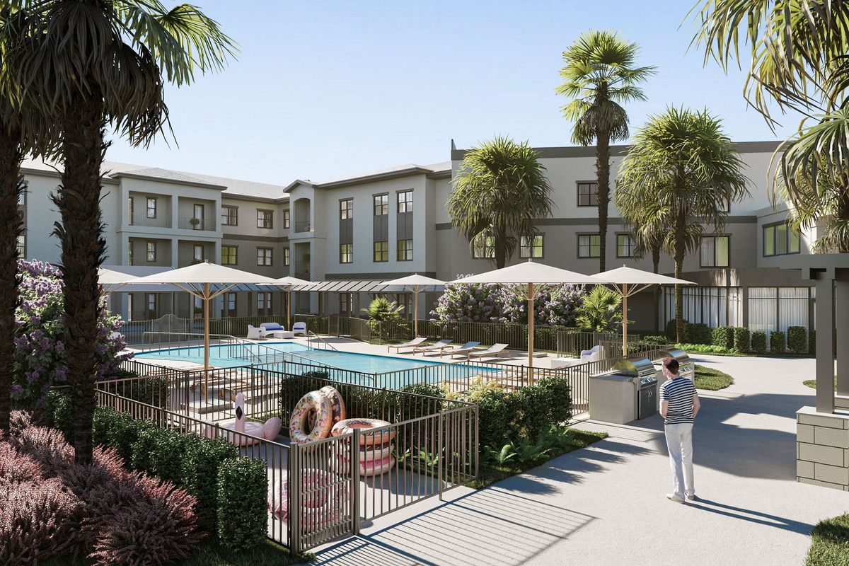 Senior living community at The Gallery At North Port featuring a pool, villa, and urban housing.