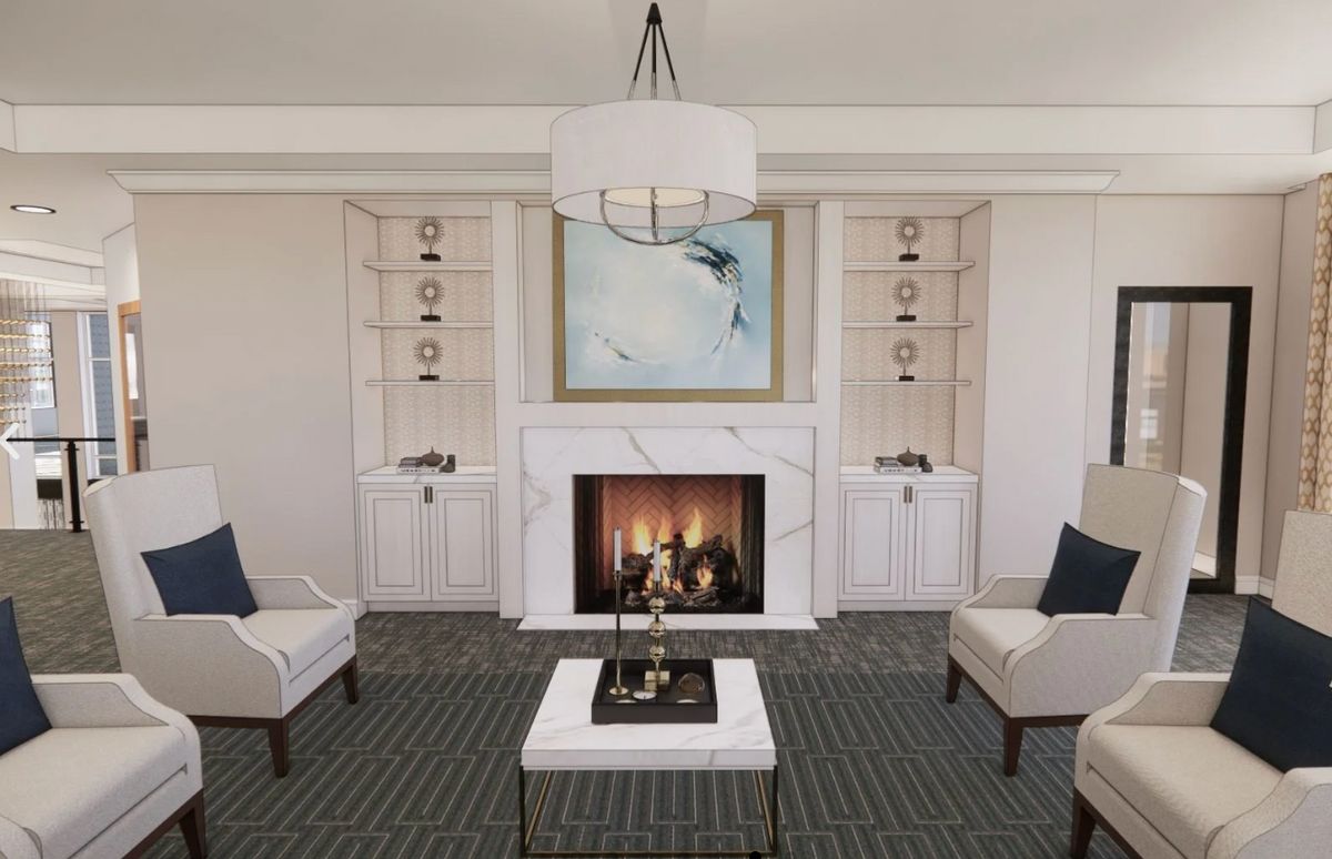 Interior view of Vared on Ventura senior living community featuring elegant decor, fireplace, and furniture.