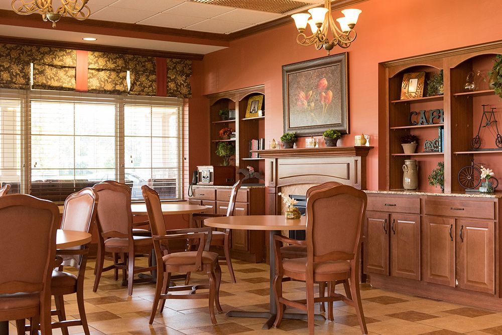 Interior view of Garden Plaza Of Florissant senior living community featuring dining and living areas.