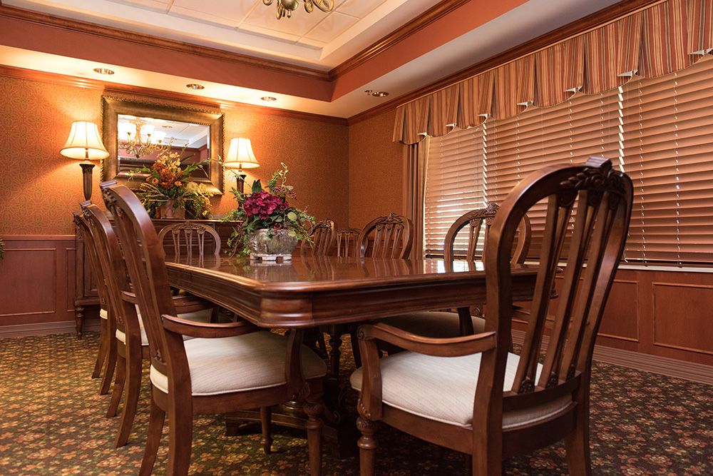 Interior view of Garden Plaza Of Florissant senior living community featuring elegant dining room design.