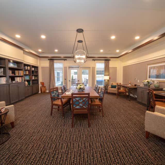 Senior living community Cornerstone At Hampton featuring elegant dining room and library decor.