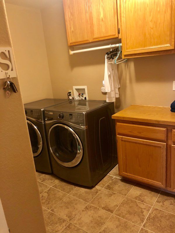 Senior living community at Angel's Home Care featuring laundry room with modern washer.