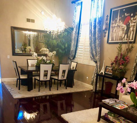 Senior living community architecture with dining room, furniture, home decor, and flower arrangements.