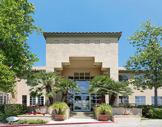 Walnut Senior Living community featuring villa-style condos, lush gardens, and city views.