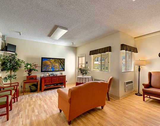 Interior view of Walnut Senior Living community featuring modern furniture, electronics, and decor.