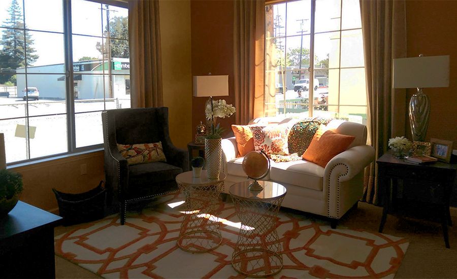 Senior living room interior at Kensington Place, Redwood City with cozy furniture and decor.