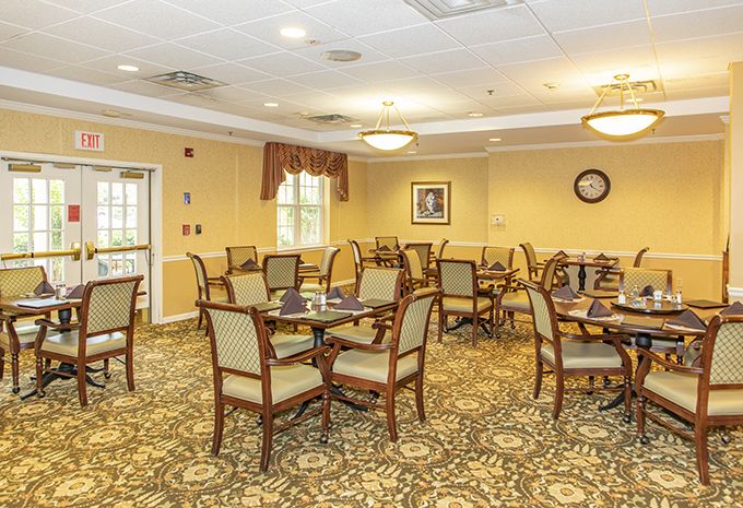 Interior view of Brightview Baldwin Park senior living community featuring dining and reception areas.