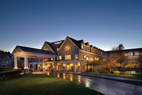 Senior living community, The Village At Duxbury, featuring lush lawns, suburban houses, and resort-style amenities.
