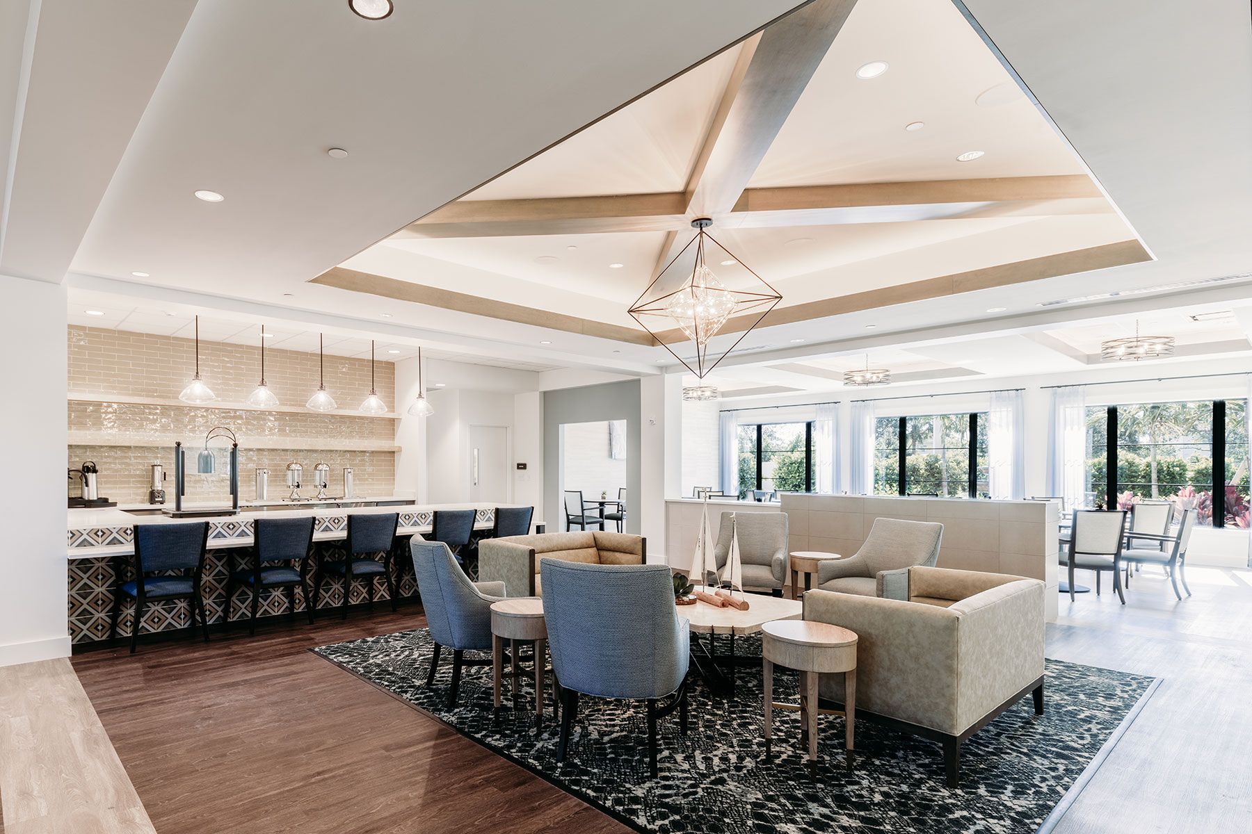 Interior view of The Capstone at Royal Palm senior living community featuring elegant dining room decor.