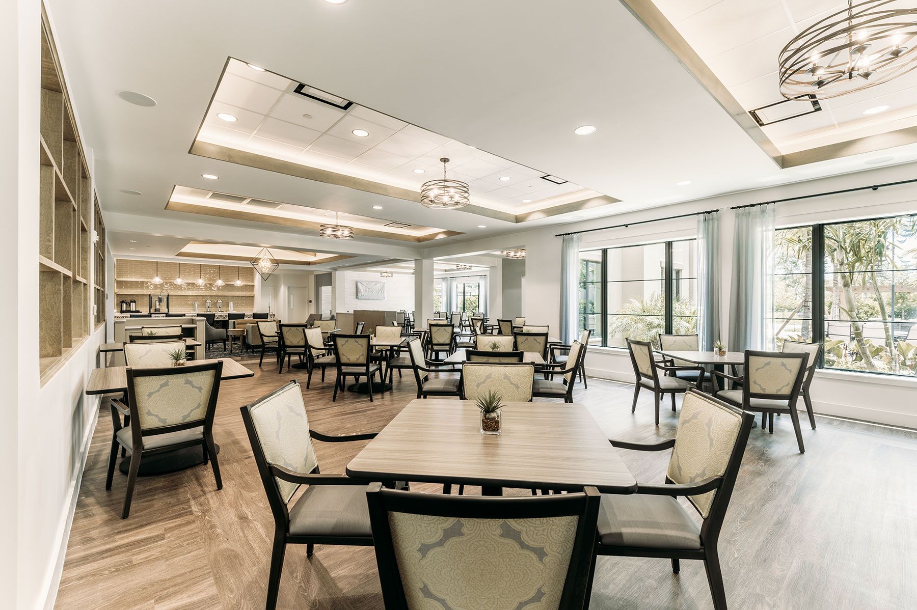 Interior view of the Capstone at Royal Palm senior living community's dining area with elegant design.