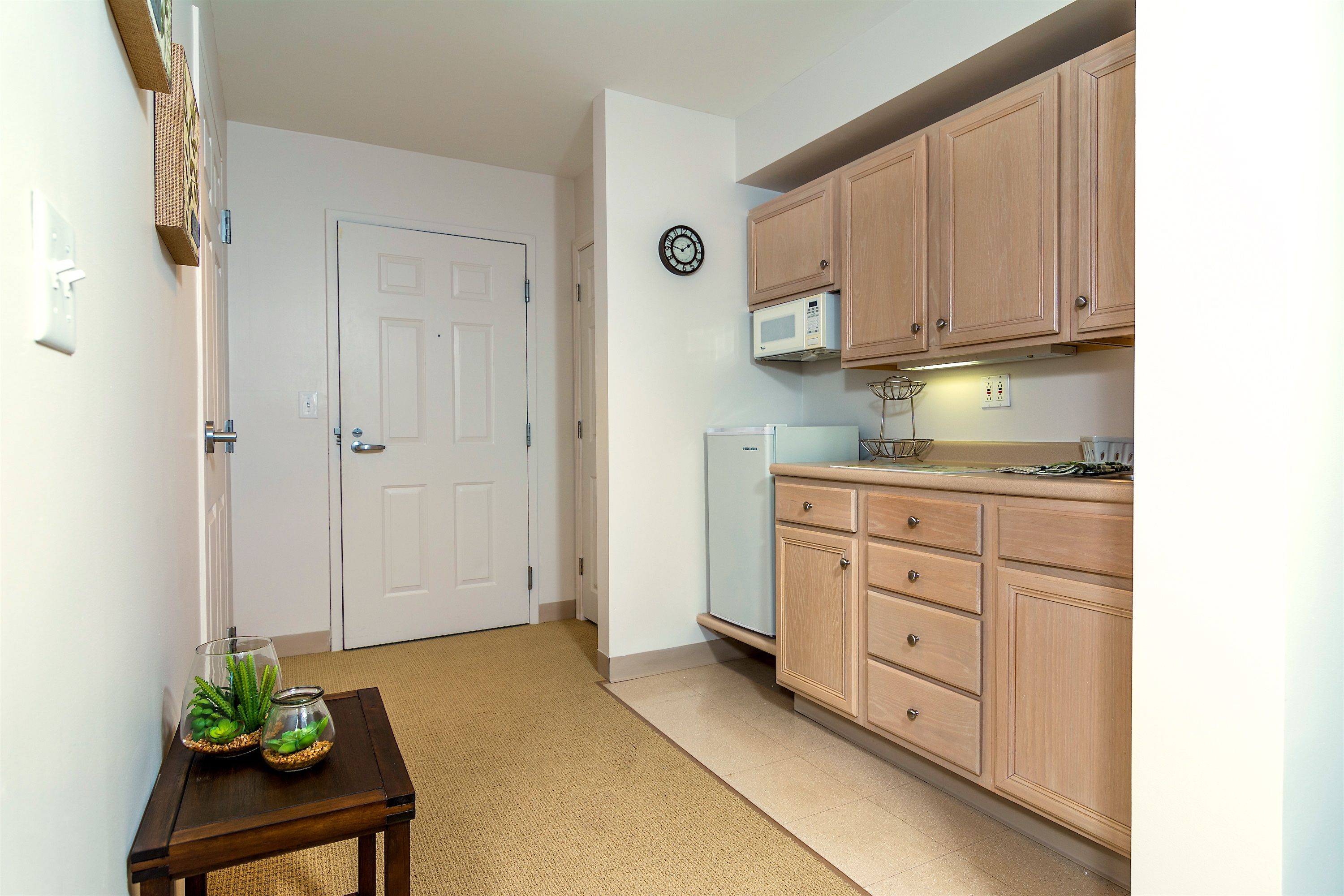 Interior view of Pacifica Senior Living Victoria Court featuring a well-equipped kitchen and cozy decor.