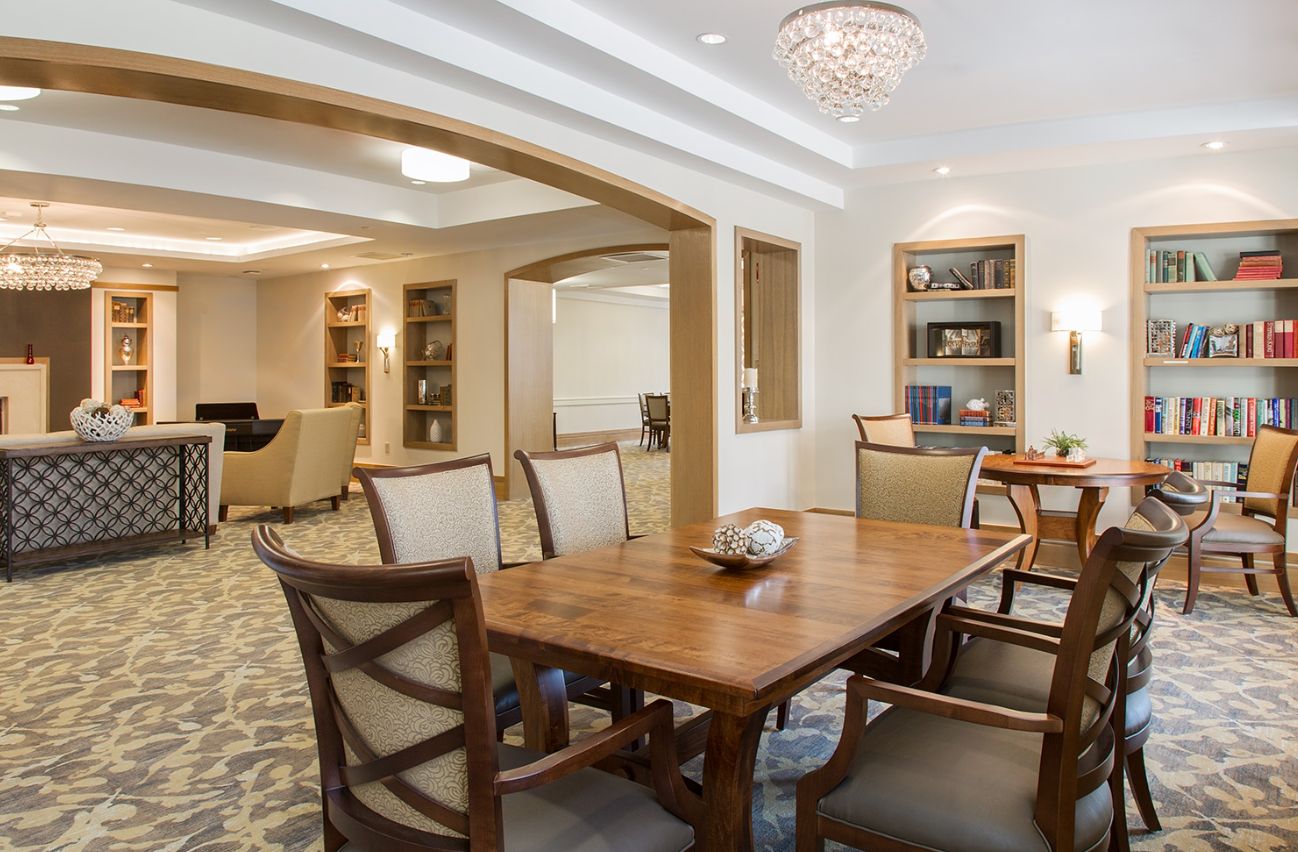 Senior living community, The Residence At Five Corners, showcasing its elegant dining room interior design.