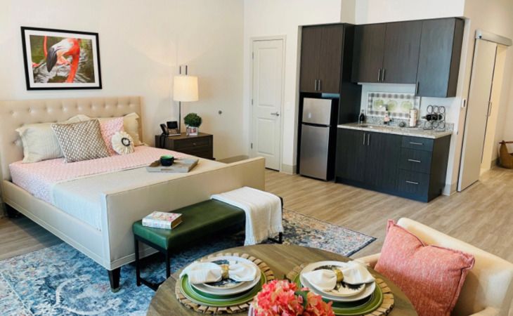 Interior view of Inspired Living Royal Palm Beach senior community featuring modern decor and appliances.